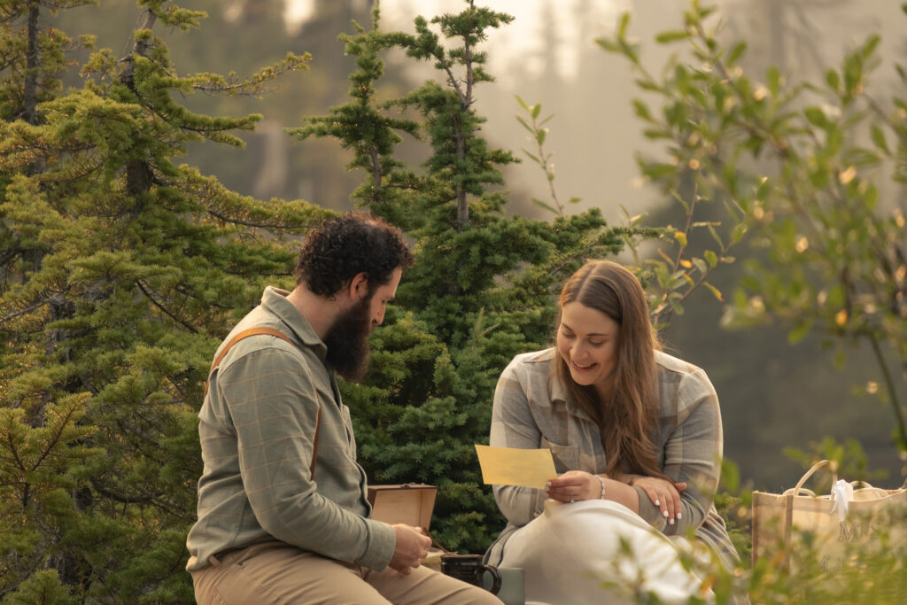 bride and groom read letters from friends on their elopement day
