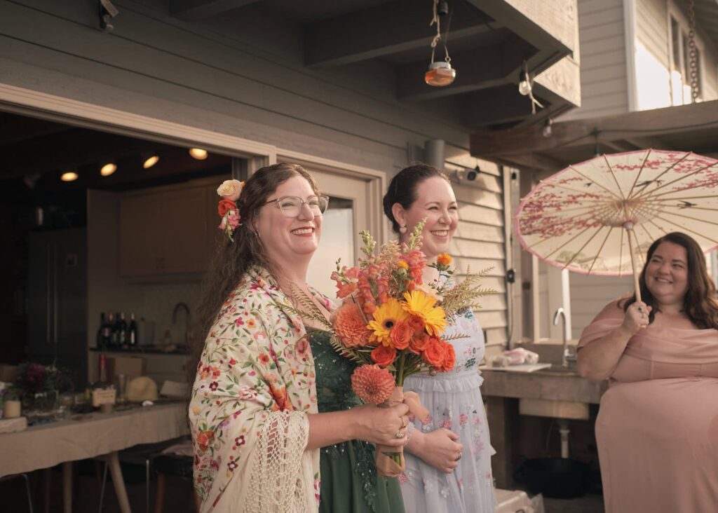 bride walks down the aisle with her friend