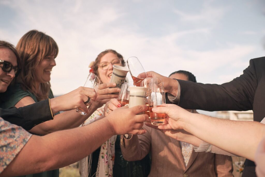friends toast newlyweds