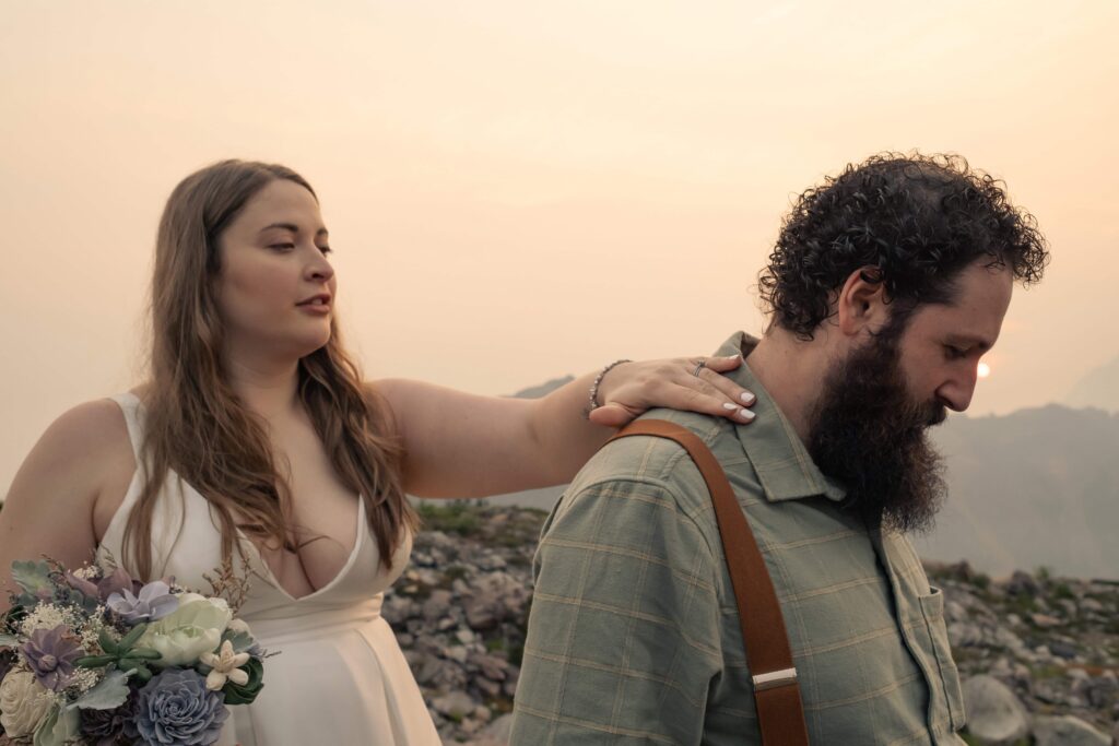 bride fixes her groom's collar